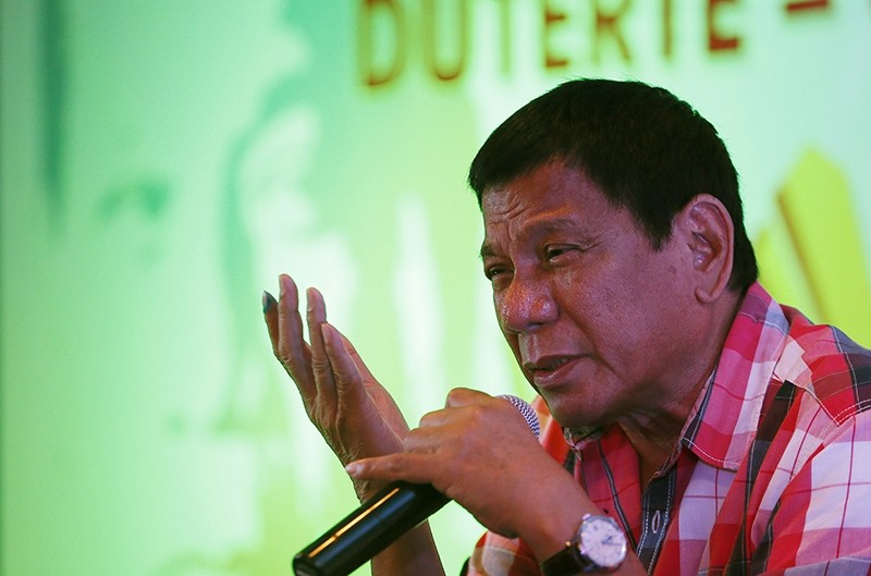 In this Monday, May 9, 2016 photo, front-running presidential candidate Mayor Rodrigo Duterte answers questions from the media during a news conference shortly after voting at his hometown in Davao city in southern Philippines (AP Photo)