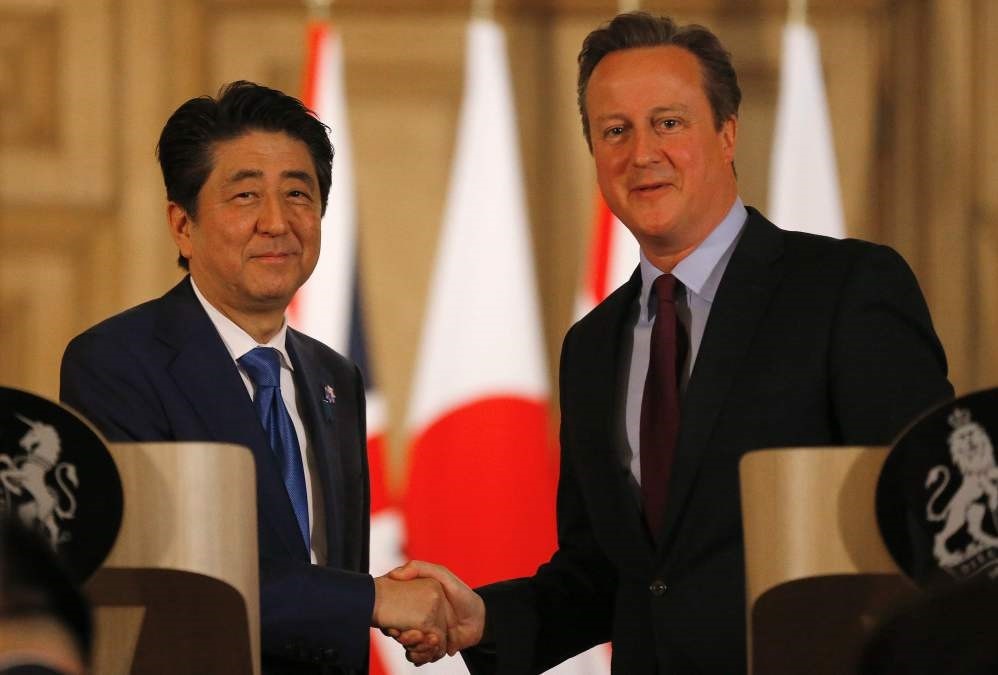 Japanese Prime Minister Shinzo Abe (L) and British Prime Minister David Cameron attend a joint press conference following a meeting in central London.