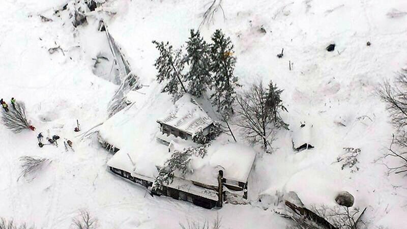 A handout photo made available by the Italian Fire Department shows an aerial view of the avalanche-hit hotel Rigopiano in the town of Farindola in Abruzzo region, Italy, 19 January 2017. (EPA Photo)