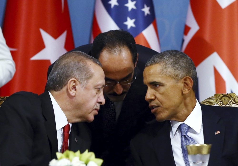 Erdou011fan (L) talks with Obama (R) during a session of the G20 Summit in Antalya, Turkey, Nov. 15, 2015.