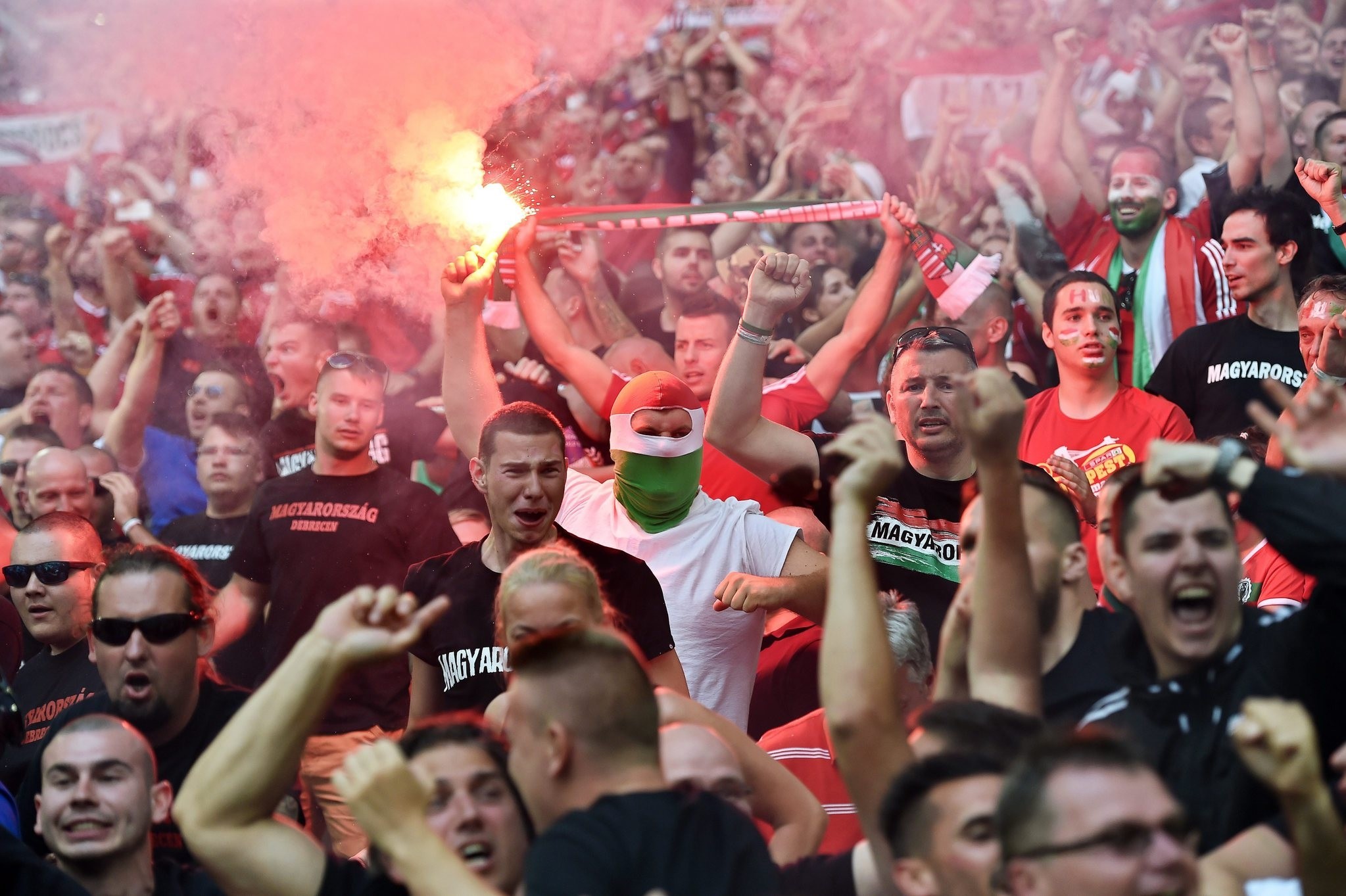  Hungarian supporters light flares during the UEFA EURO 2016 group F preliminary round match between Iceland and Hungary at Stade Velodrome in Marseille, France, 18 June 2016. (EPA Photo)