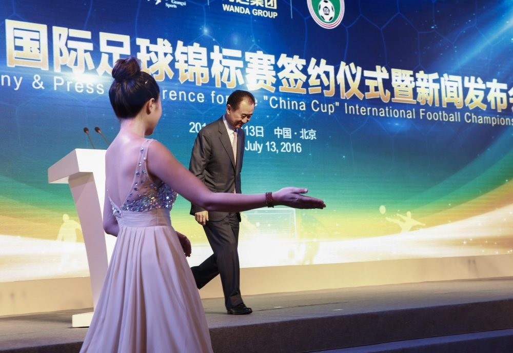 Wang Jianlin, Chairman of Chinau2019s Wanda Group walks off the stage after giving a statement during ceremonies to mark a signing ceremony and press conference for the u2018China Cupu2019 international football tournament in Beijing.