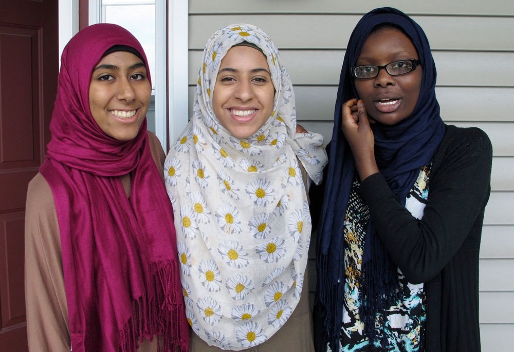 In this July 7, 2016 photo, Kirin Waqar, Lena Ginawi and Hawa Adam, members of Muslim Girls Making Change, pose for a photo in South Burlington, VT. (AP Photo)
