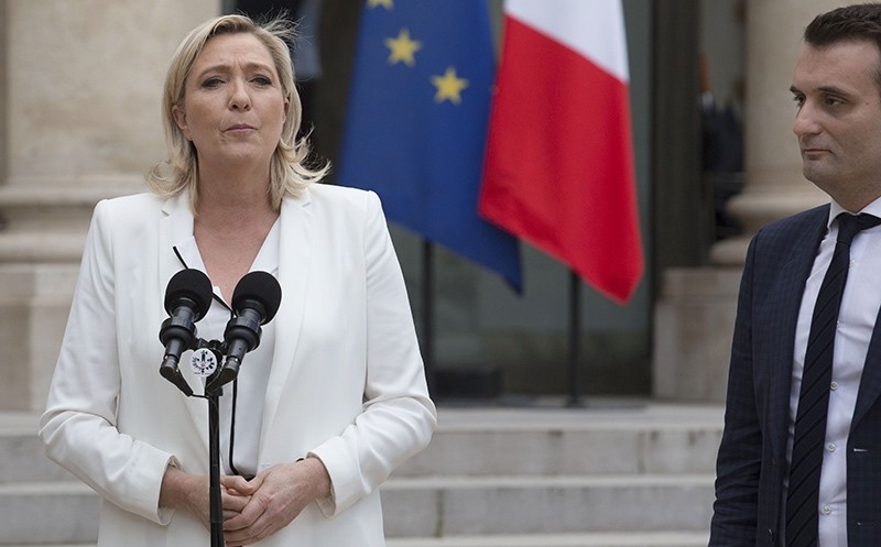 France's Far-right National Front (FN) party leader Marine Le Pen (L) makes a statement, next to FN vice-president Florian Philippot, following a meeting with French President on June 25, 2016 at the Elysee Palace in Paris (AFP Photo)