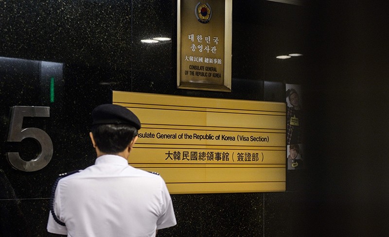 A member of security stands in the lift lobby at the South Korean Consulate in Hong Kong on July 28, 2016 (AFP Photo)