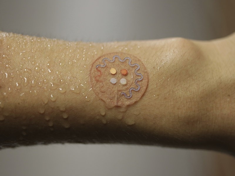 Researchers created a skin patch that can test droplets of sweat to track health while people exercise, beaming results to their smartphones. (AP Photo)