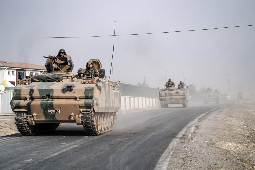 Turkish army tanks and armored personnel carriers move toward the Syrian border, Karkamu0131u015f, to support Free Syrian Army forces in the fight against Daish, Aug. 25, 2016.