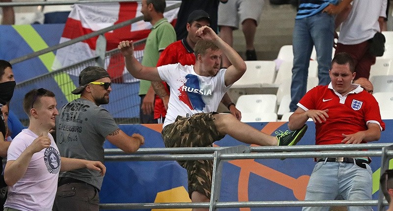 Russian supporters attack an England fan at the end of the Euro 2016 Group B soccer match between England and Russia, at the Velodrome stadium in Marseille, France. (AP Photo)