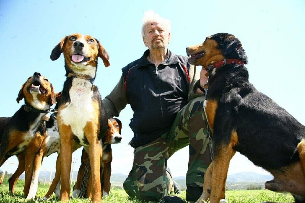 Dou011fan Kartay, pictured with zau011far dogs, claim Greeks kidnap watch dogs from Turkey.