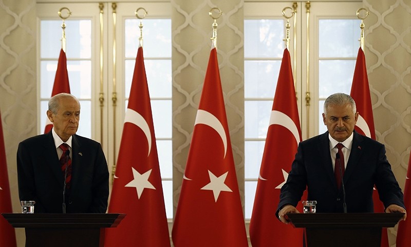MHP's Chairman Devlet Bahu00e7eli (Left) at a press conference following a meeting with Prime Minister Binali Yu0131ldu0131ru0131m (Right) in Ankara on July 19, 2016 (AA Photo) 