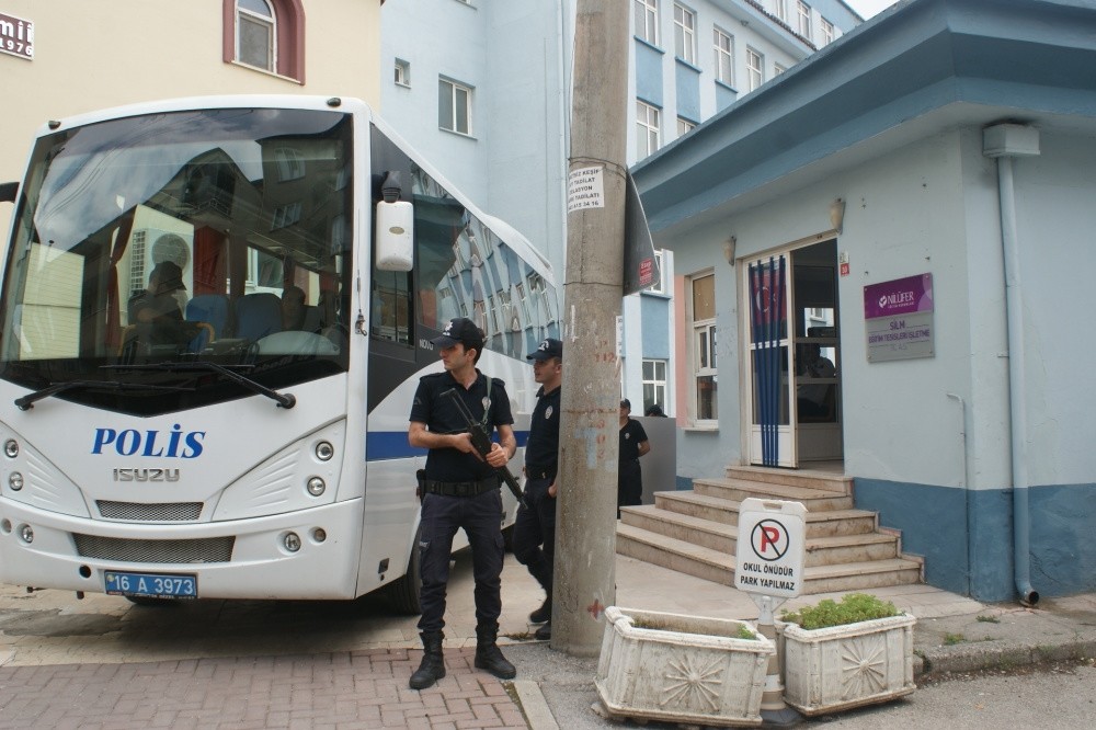 Police officers stand guard outside a Gu00fclen-linked school in the city of Bursa. The schools have been scrutinized since 2013 for their links to the Gu00fclenist Terror Organization.