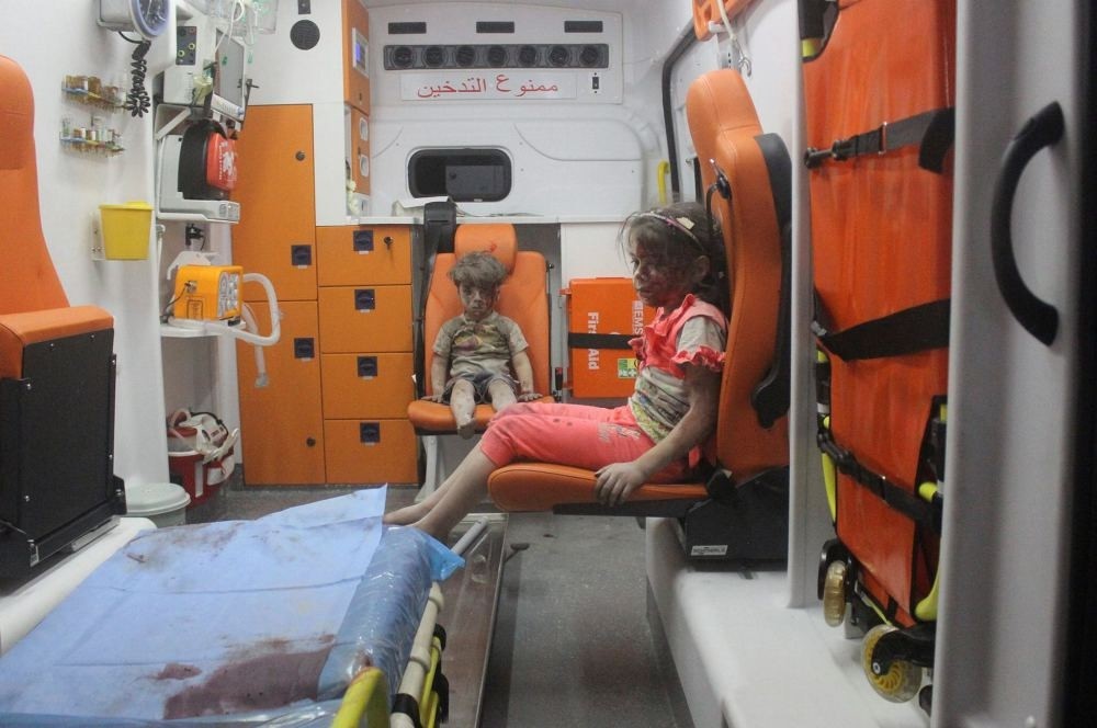 Five-year-old Omran Daqneesh with a bloodied face with his sister in an ambulance. (Reutters Photo)