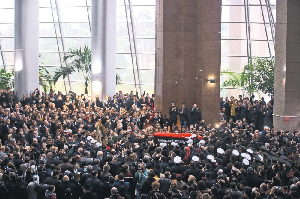 Hundreds attended the funeral ceremony for Fethi Sekin and Musa Can, two victims of the attack, at the courthouse they worked. (AFP)