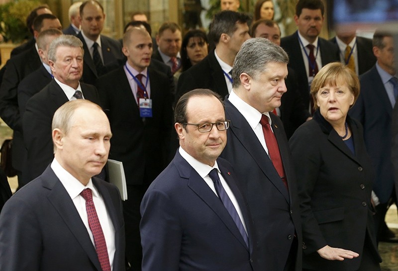 Russia's President Vladimir Putin (L, front), Ukraine's President Petro Poroshenko (2nd R, front), Germany's Chancellor Angela Merkel (R, front) and France's President Francois Hollande (Reuters Photo)