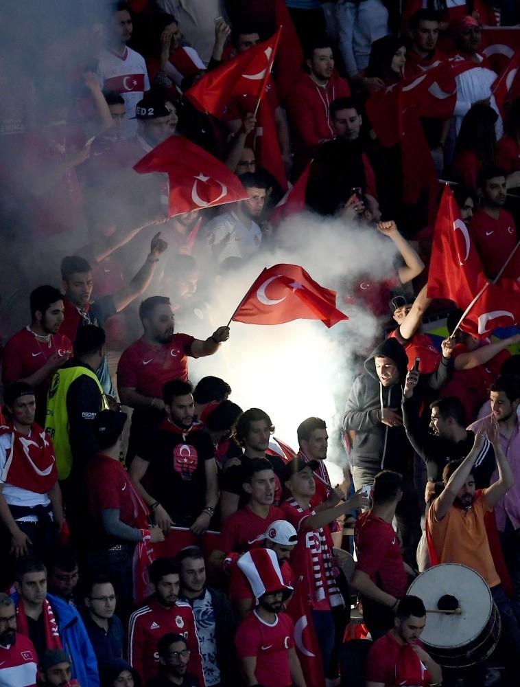 Supporters of Turkey light a flare during UEFA EURO 2016 group D preliminary round match between Czech Republic & Turkey at Stade Bollaert-Delelis in Lens, France, on Tuesday. World sports market is expected to reach $100 billion by 2018.