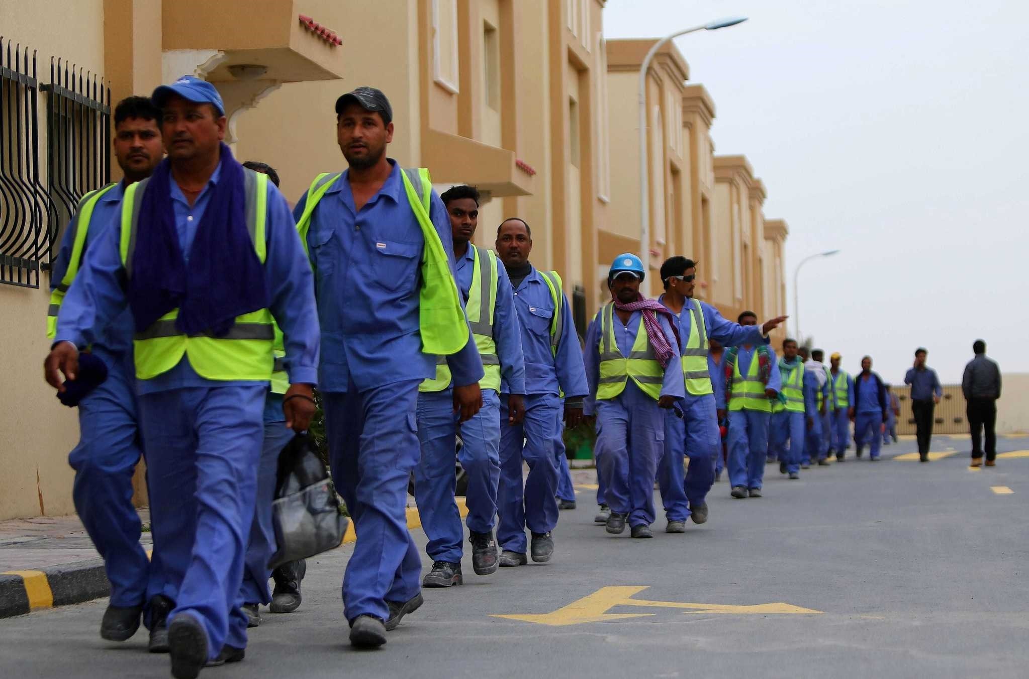 Foreign laborers work at the construction site of the al-Wakrah football stadium, one of Qataru2019s 2022 World Cup stadiums.