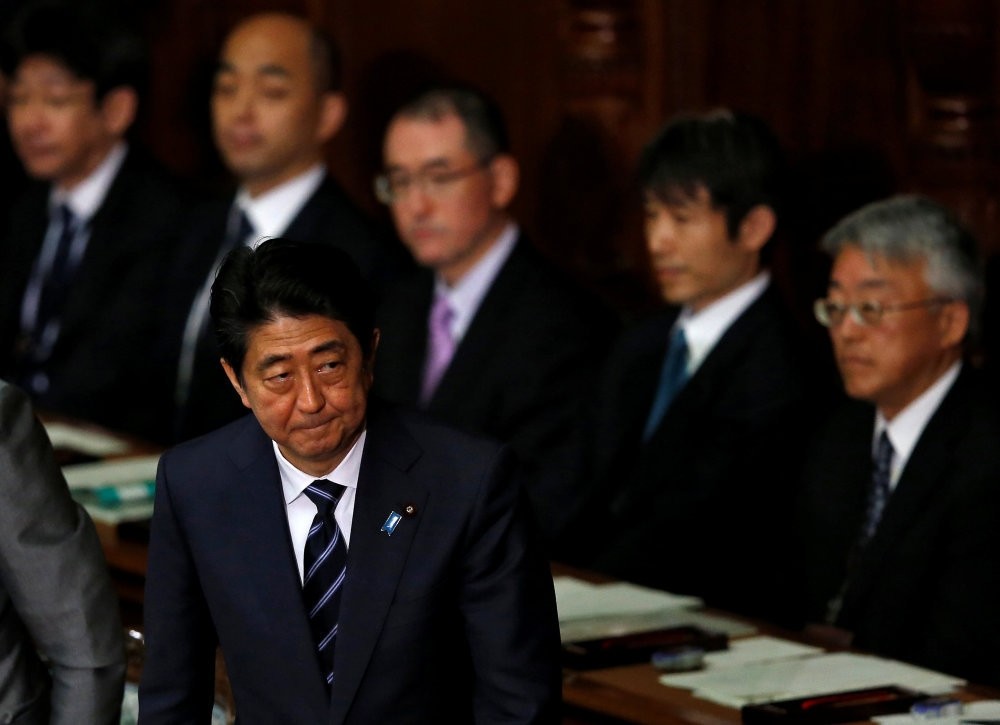 Japanese Prime Minister Abe leaves after the lower house defeated a no-confidence motion against his cabinet, which was submitted by four opposition parties at parliament in Tokyo, Japan, May 31.