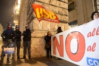 Policemen standing guard as the ,NO, voters in the constitutional referendum celebrate near the Palazzo Chigi after the end of the vote in Rome, Dec. 4, 2016.