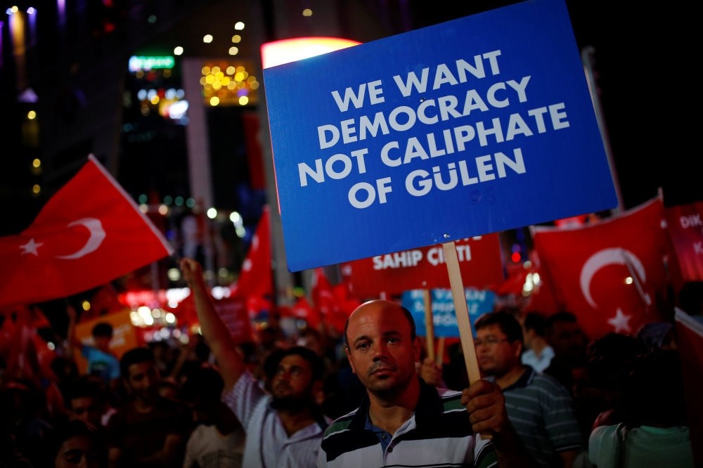 A man holding a banner at a gathering of the people in solidarity night after night since the July 15 coup attempt in central Ankara, July 27.