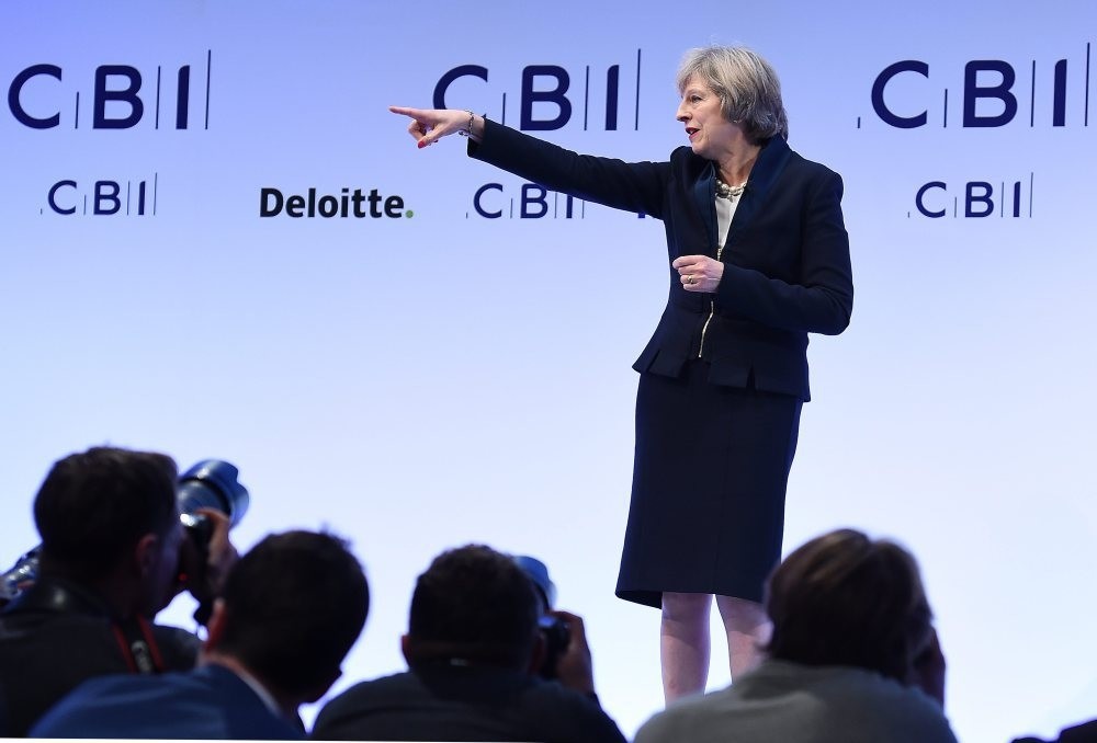 British Prime Minister Theresa May delivers a speech on Brexit and the British economy at the CBI conference in central London yesterday.