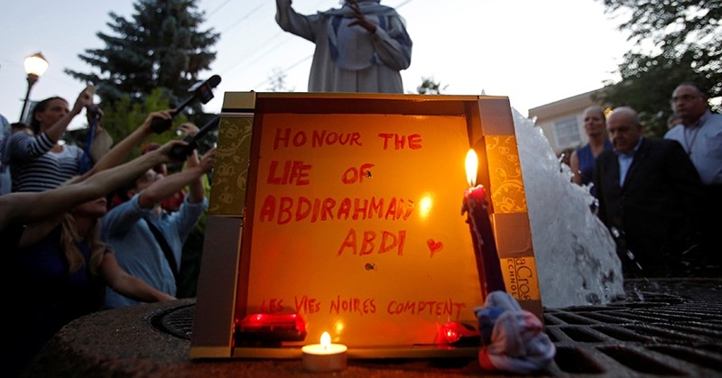 woman speaks during a vigil for Abdirahman Abdi, a Somali immigrant to Canada who died after being hospitalized in critical condition following his arrest by Canadian police, in Ottawa (Reuters Photo)