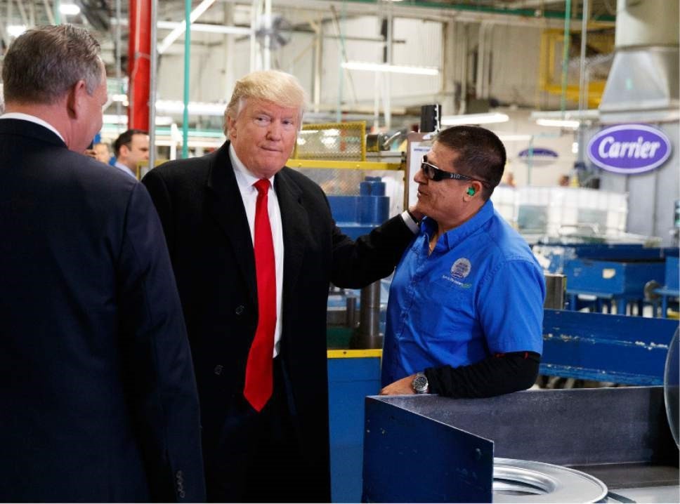 President-elect Donald Trump talks with workers during a visit to the Carrier factory, Thursday in Indianapolis.
