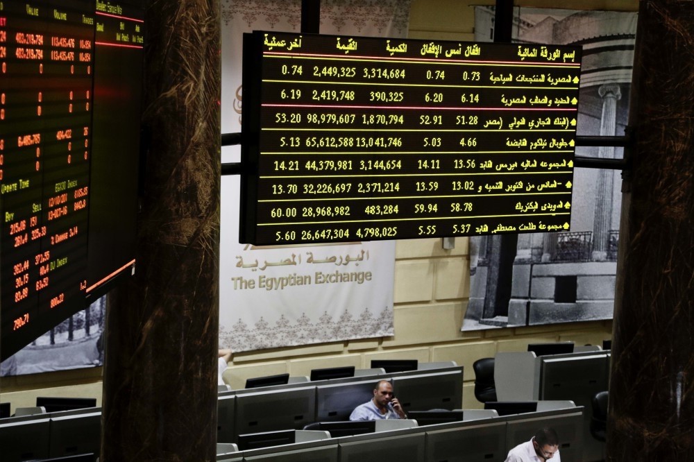 Egyptian traders work on the floor of the stock market in Cairo.