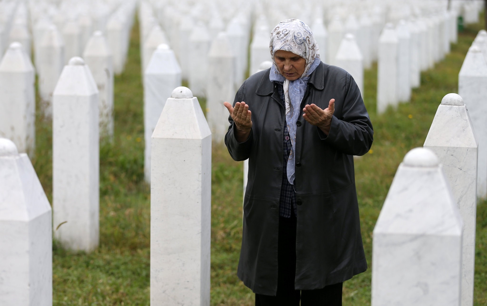 Hatidza Mehmedovic prays near the graves of her two sons and husband in Potocari near Srebrenica, Bosnia and Herzegovina, October 17, 2016. (Reuters Photo)
