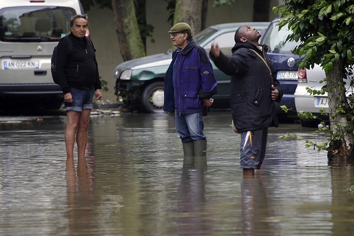 Residents check their parking lot in Longjumeau, south of Paris, France Thursday June 2, 2016. (AP Photo)