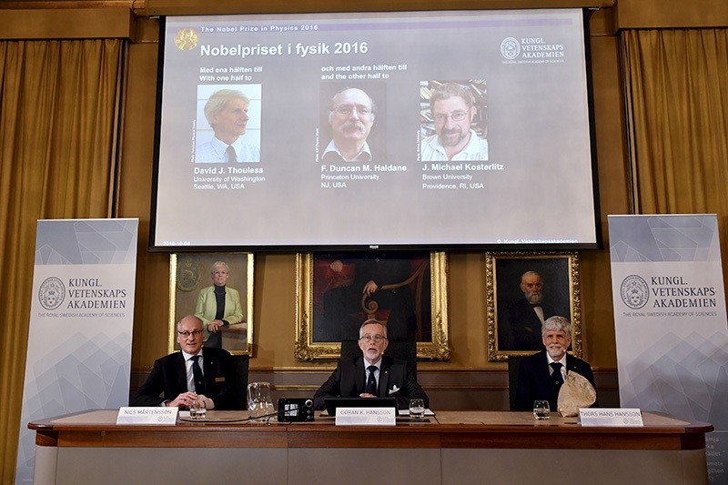Nobel jury reveal the winners of the Nobel Prize in physics, David Thouless, Duncan Haldane and Michael Kosterlitz, the Royal Swedish Academy of Sciences, Stockholm, Oct. 4, 2016. (AP Photo)
