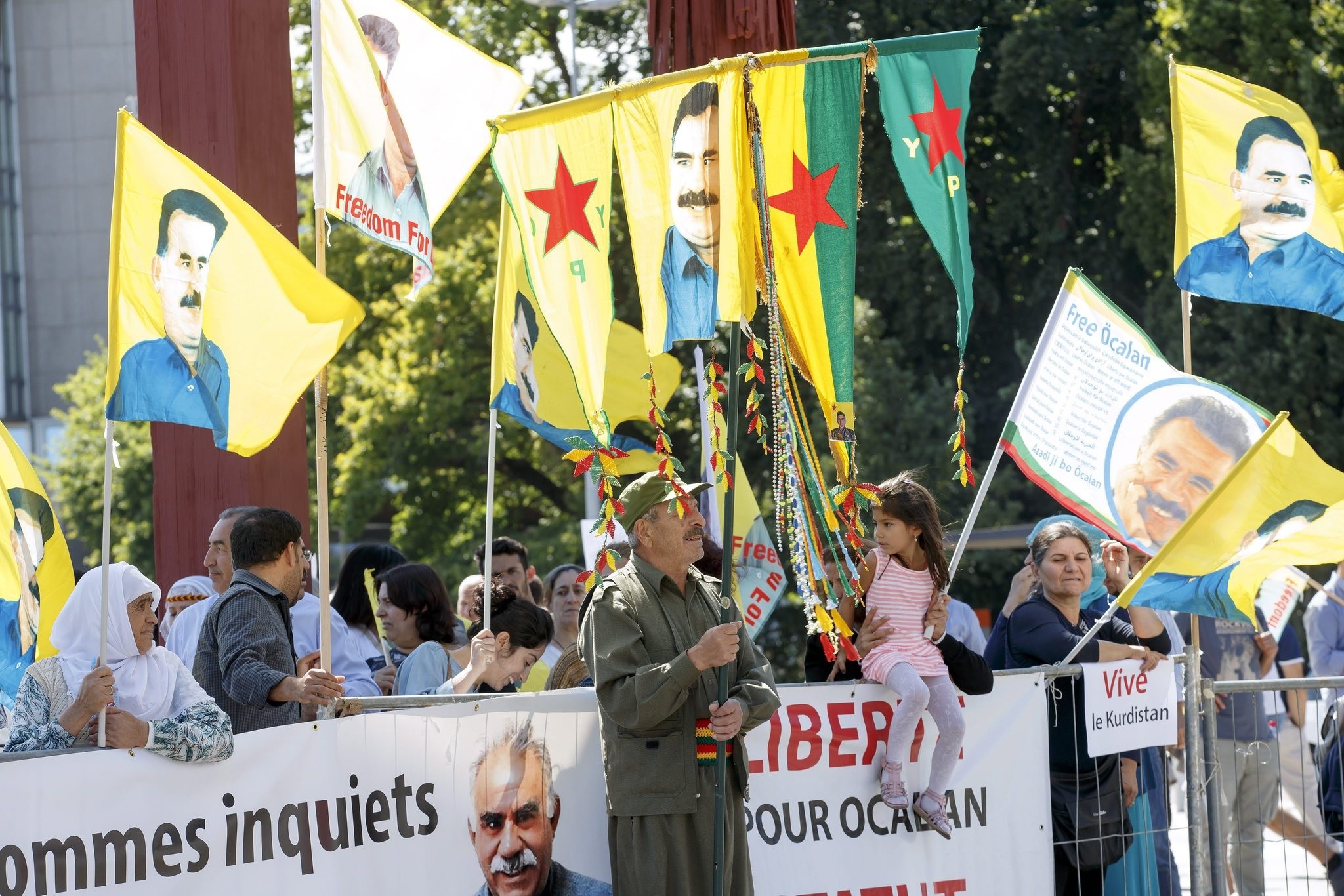 PKK supporters hold flags with the portrait of PKK leader Abdullah Ocalan during a rally against the Turkish government, in Geneva, Switzerland, 11 August 2016. (EPA Photo)