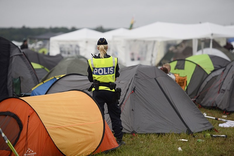 Swedish police officer stands guard at camp site. (AP File Photo)