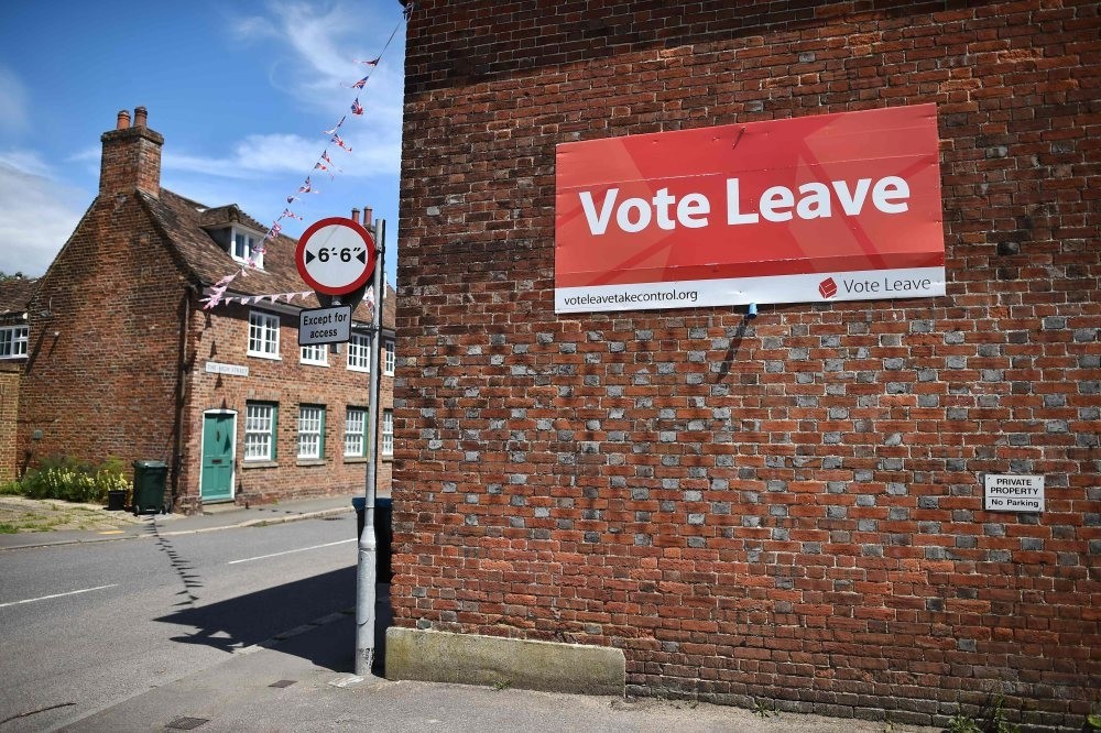 A u2018Vote Leaveu2019 sign is seen on the side of a building in Charing on June 16, 2016 urging people to vote for Brexit in the upcoming EU referendum.