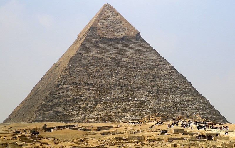 Local and foreign tourists visit the Pyramid of Khufu, the largest of the Great Pyramids of Giza. (AP Photo)