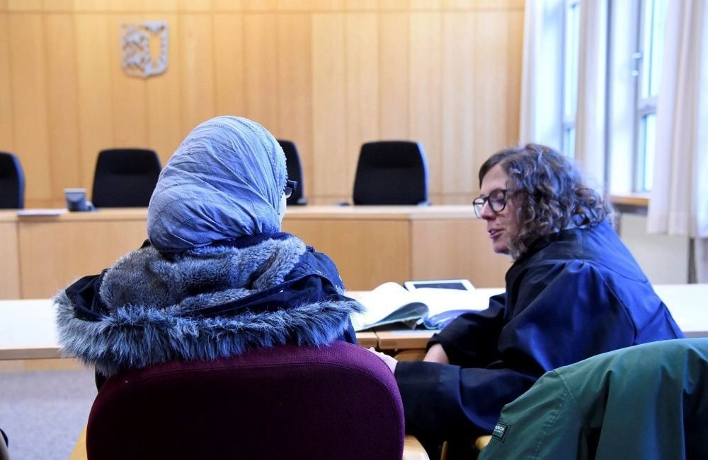A Syrian refugee waits for an appeal hearing to begin in a hearing room at the Higher Administrative Court (OVG) in Schleswig, Germany, Nov. 23.