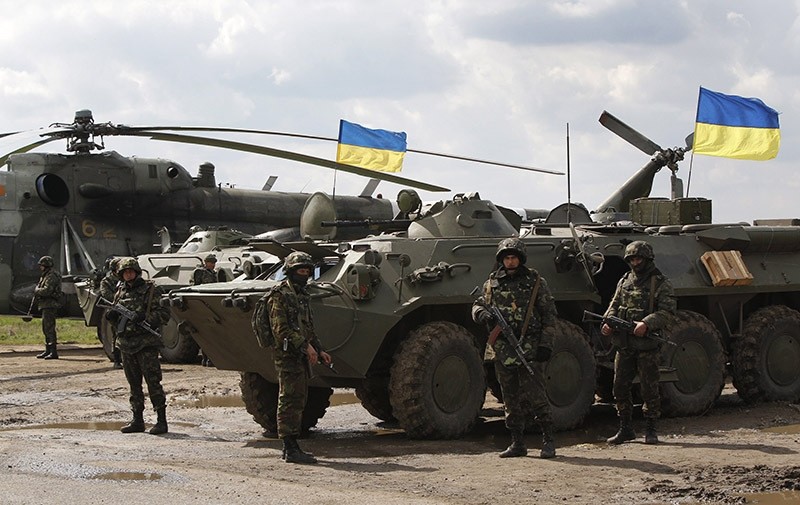 Ukrainian troops in a field on the outskirts of Izyum, Eastern Ukraine. April 2014. (AP Photo)