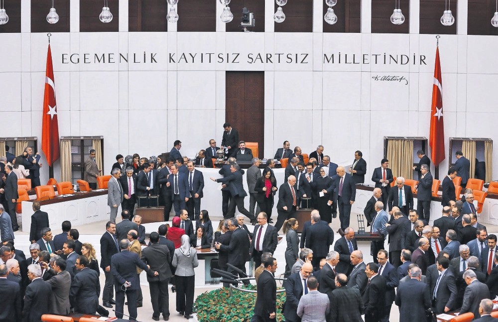 Turkish lawmakers casting their votes during a session debating the reform of the Constitution at the Turkish Parliament in Ankara.