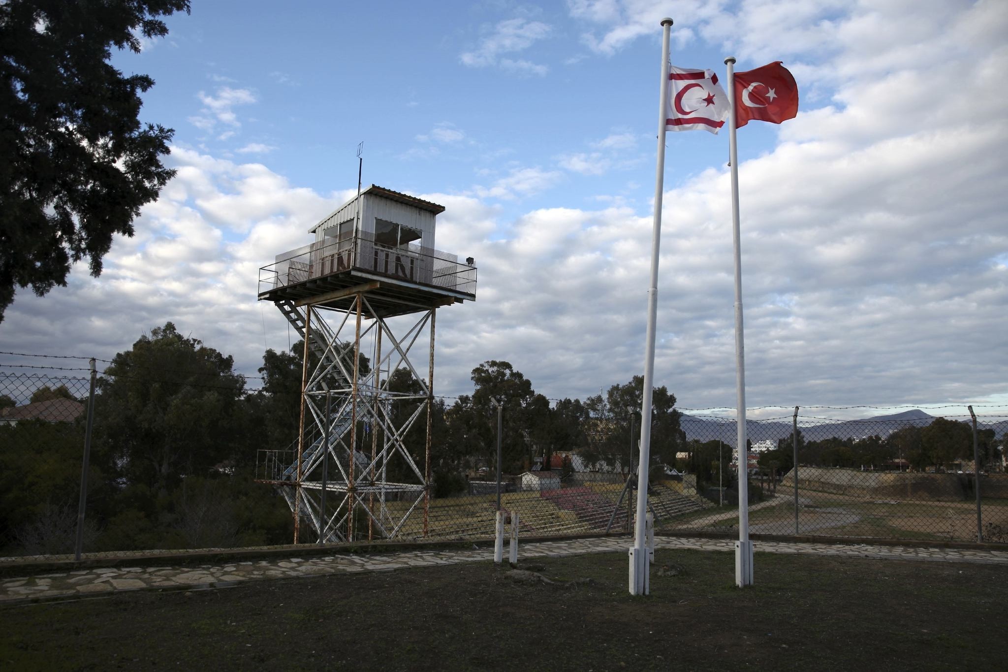A U.N. guard post is seen in the buffer zone as the Turkish and Turkish Cypriot flags wave in the northern part of Nicosia, Turkish Republic of North Cyprus, Jan. 12, 2017.