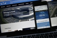 Web pages of GCHQ and the British Security Service (MI5) are shown on a computer and smartphone. (AP Photo)
