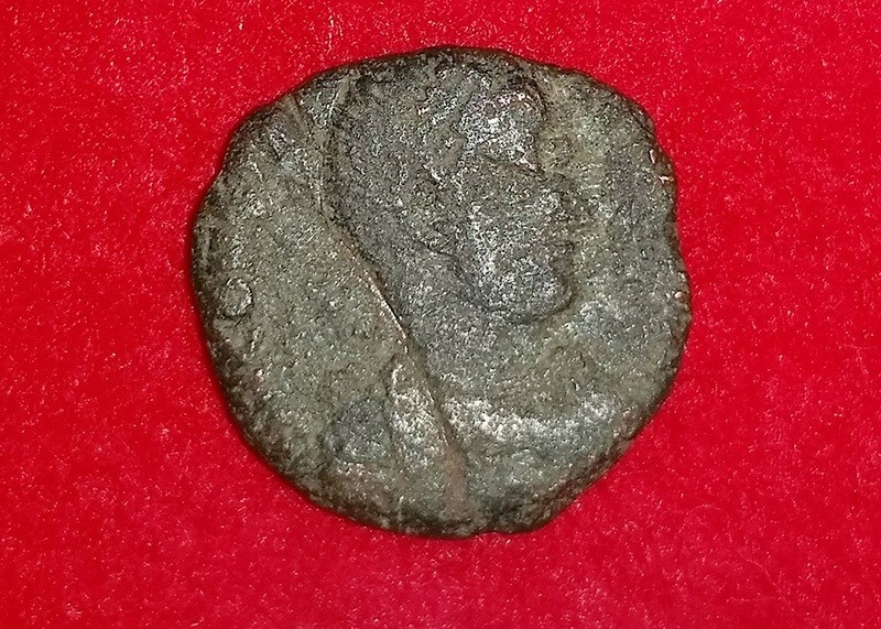 This handout photo released on September 26, 2016 by the Uruma city municipal office and received via Jiji Press on September 28 shows a 4th-century copper coin from ancient Rome (AFP Photo)