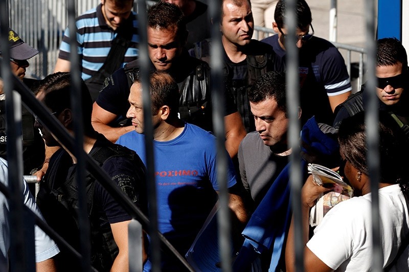 Two of the eight coup plotters are escorted by special police forces after the postponement of their interviews for asylum request at the Asylum Service in Athens, Greece, July 27, 2016. (Reuters Photo)