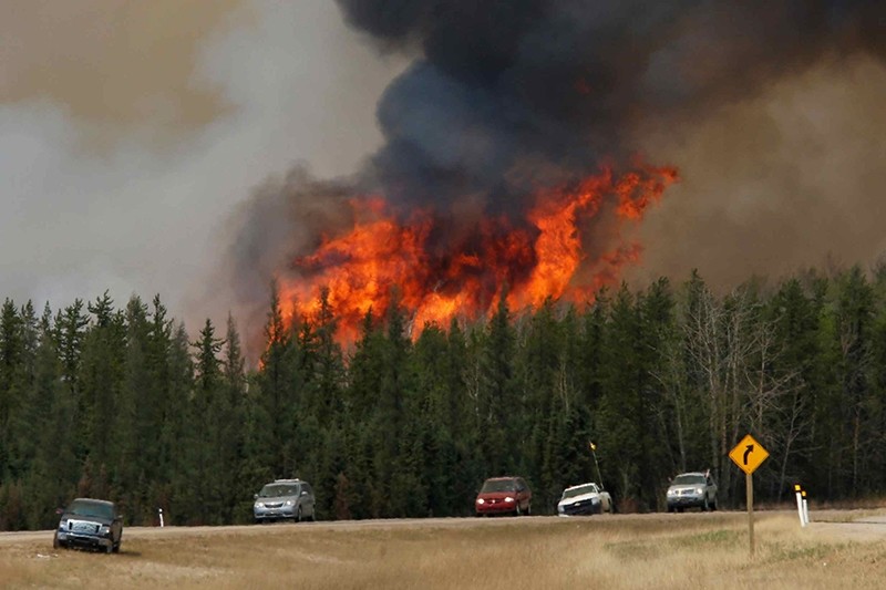 Canada wildfire flareups near Fort McMurray force evacuations of