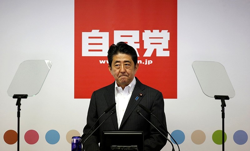 Japan's Prime Minister and leader of the ruling Liberal Democratic Party (LDP) Shinzo Abe attends a news conference following a victory in the upper house elections by his ruling coalition (Reuters Photo)
