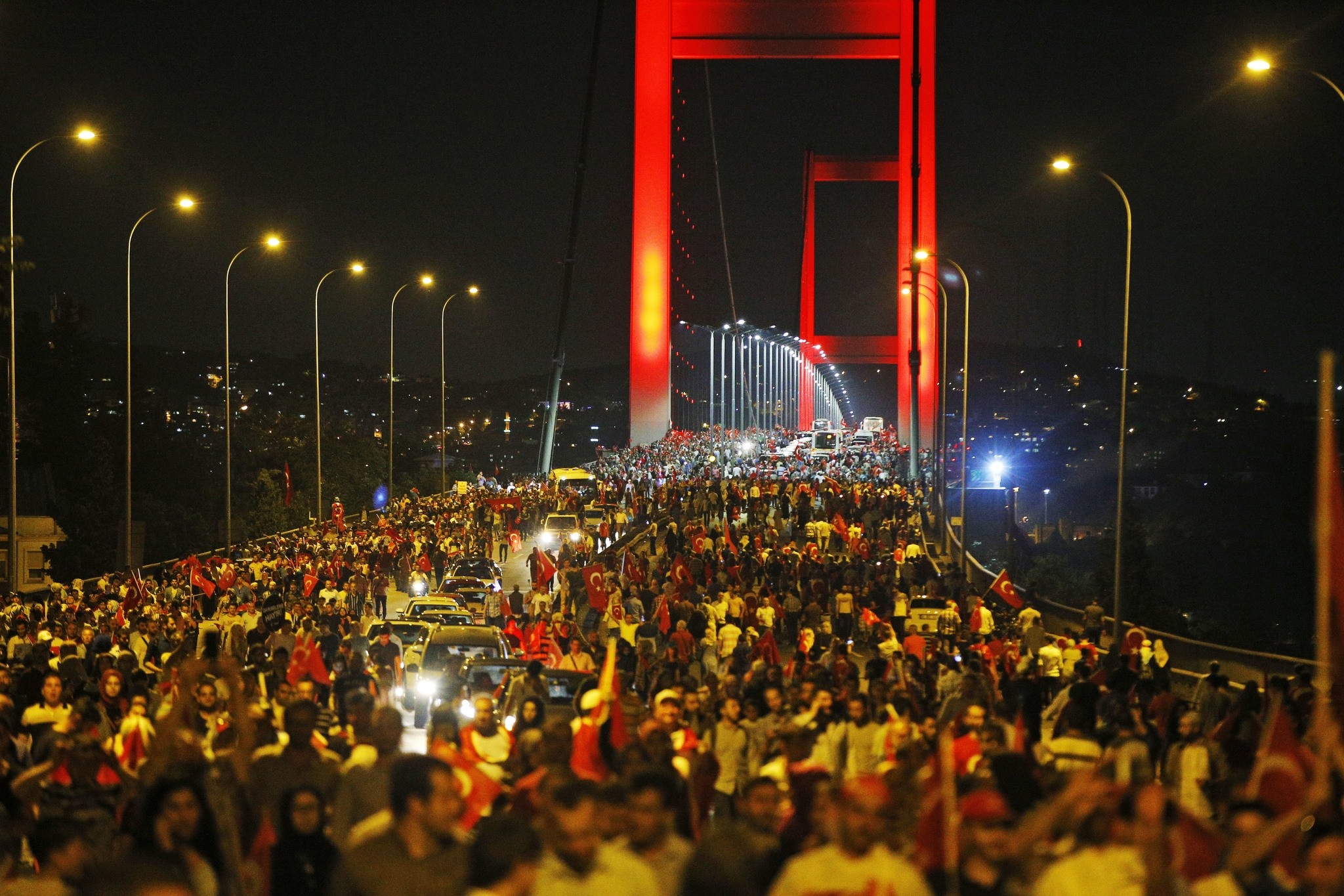 Turkish people protest on Istanbul's iconic Bosporus Bridge, late Thursday, July 21, 2016. (AP Photo)
