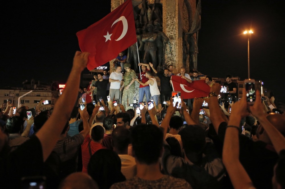The people of Turkey gather against the Gulenist terrorists' coup attempt, waving Turkish flags, in Istanbul's Taksim square, July 16, 2016.