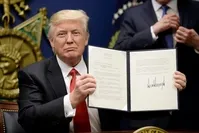 U.S. President Donald J. Trump signs an executive orders in the Hall of Heroes at the Pentagon in Arlington, Virginia, Jan. 27.