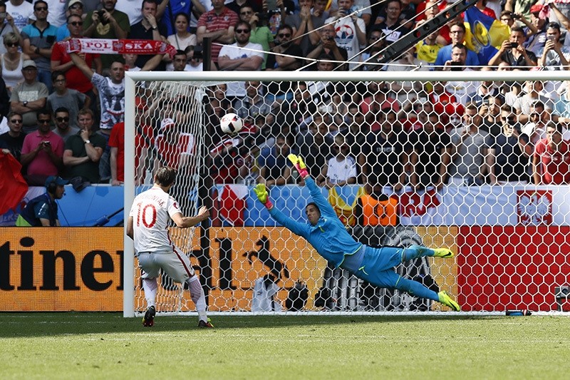Poland's Grzegorz Krychowiak scores during the penalty shootout to win the match (Reuters Photo)