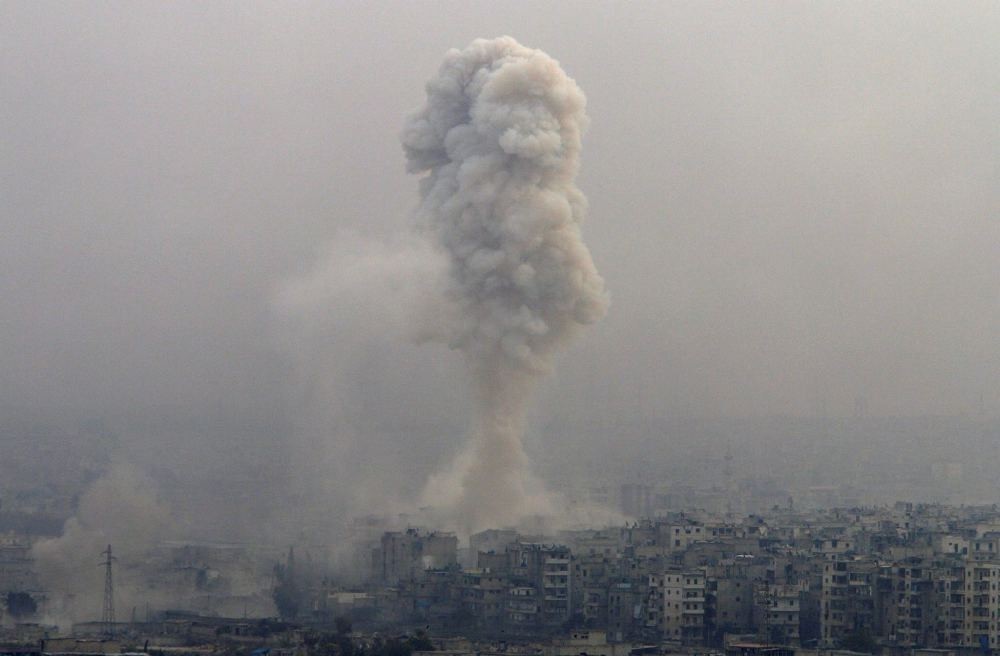 Smoke rises after airstrikes on opposition-controlled besieged eastern Aleppo, Syria, Dec. 5.