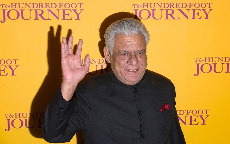 This file photograph taken on September 3, 2014, shows Indian Bollywood actor Om Puri waving as he attends the UK Gala Screening of the film, The Hundred Foot Journey, in central London. (AFP Photo)