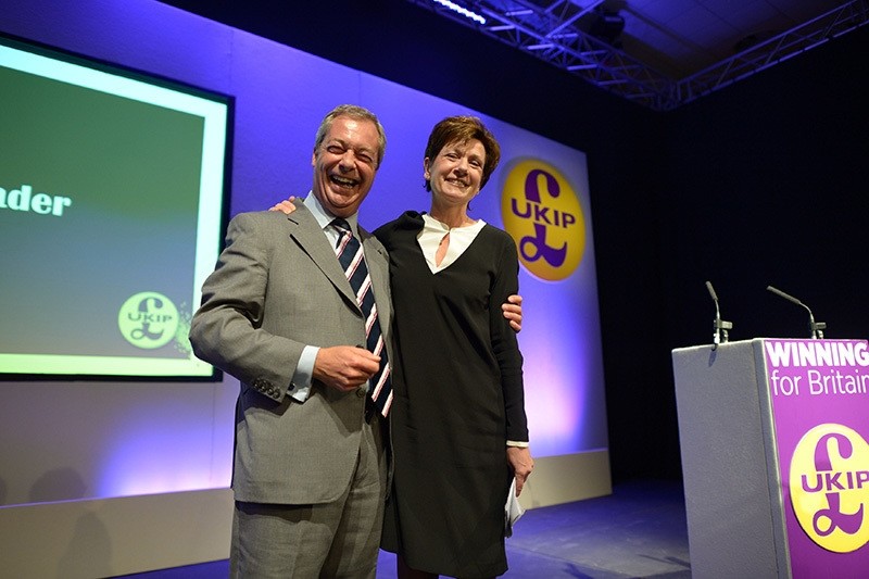 Diane James celebrates with Nigel Farage after being named as the new leader of the UK Independence Party at the party's annual conference in Bournemouth, England, Friday, Sept. 16, 2016. (AP Photo)